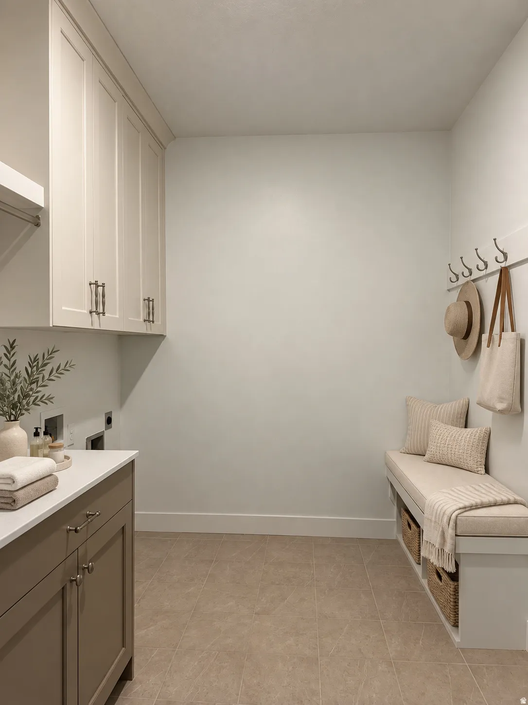 Built-in cabinetry with modern hardware, white countertop, tile flooring, and a built-in bench with storage