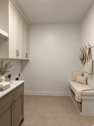 Built-in cabinetry with modern hardware, white countertop, tile flooring, and a built-in bench with storage