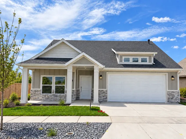 Craftsman-style exterior with stone and siding accents