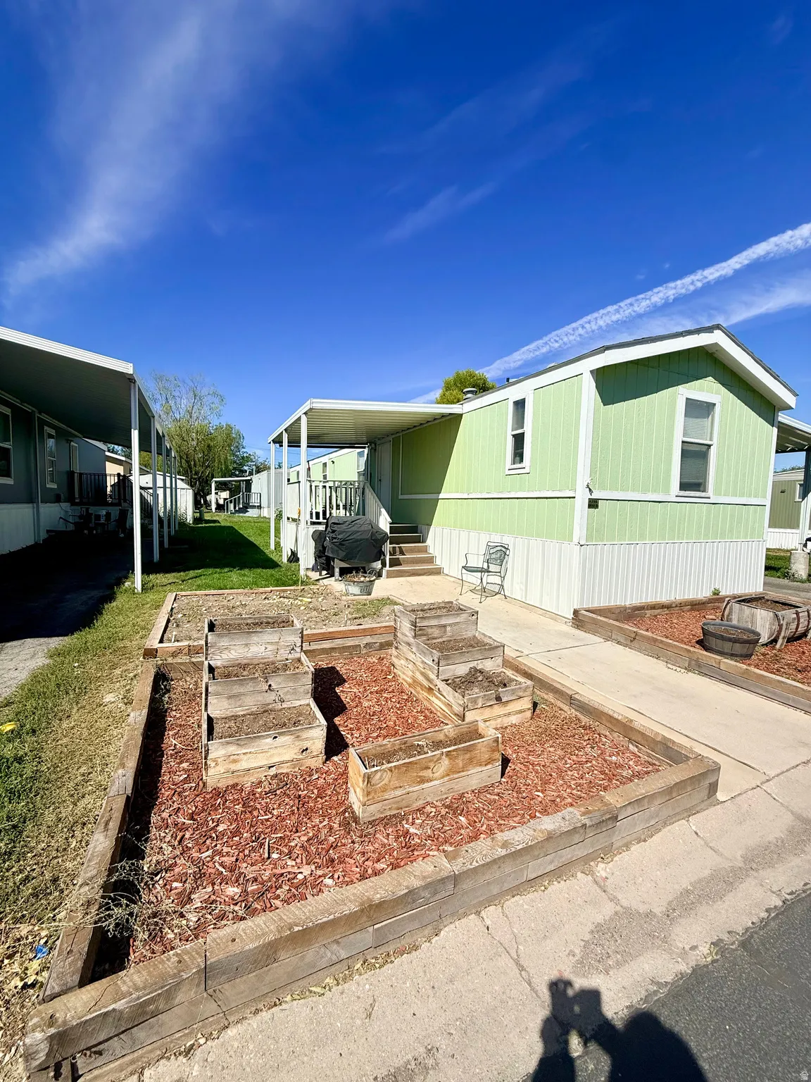 Light green exterior siding with white trim