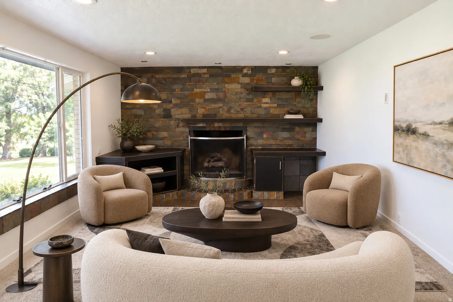 Stacked stone fireplace with built-in hearth, wood-finish floating shelves, recessed lighting, and large picture windows
