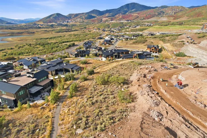 Mountain landscape with a body of water and distant residential developments
