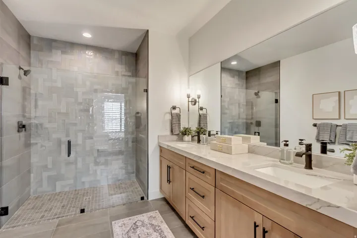 Dual vanity with integrated sinks and a stone countertop