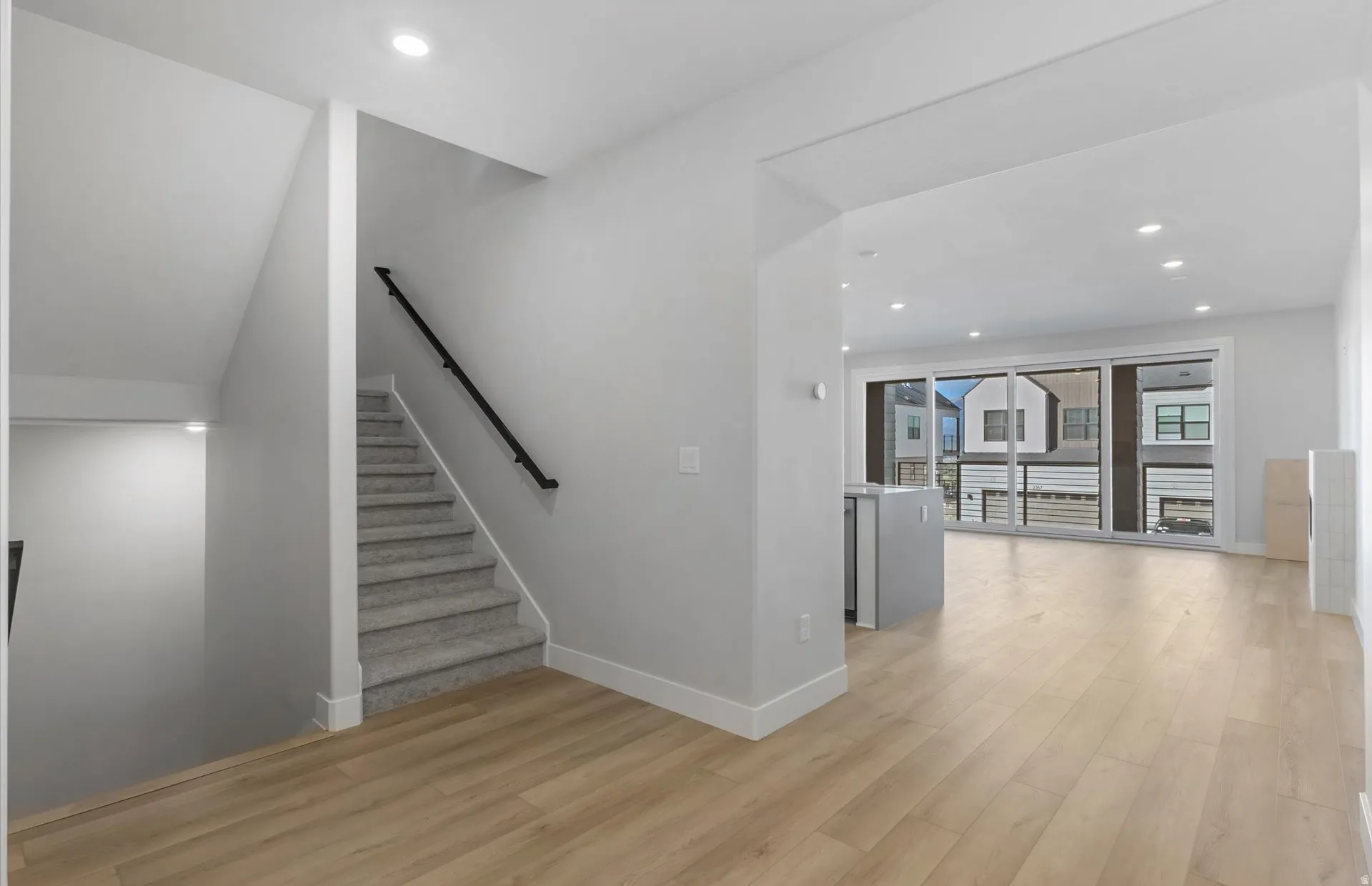 Light wood-finish flooring throughout the main level