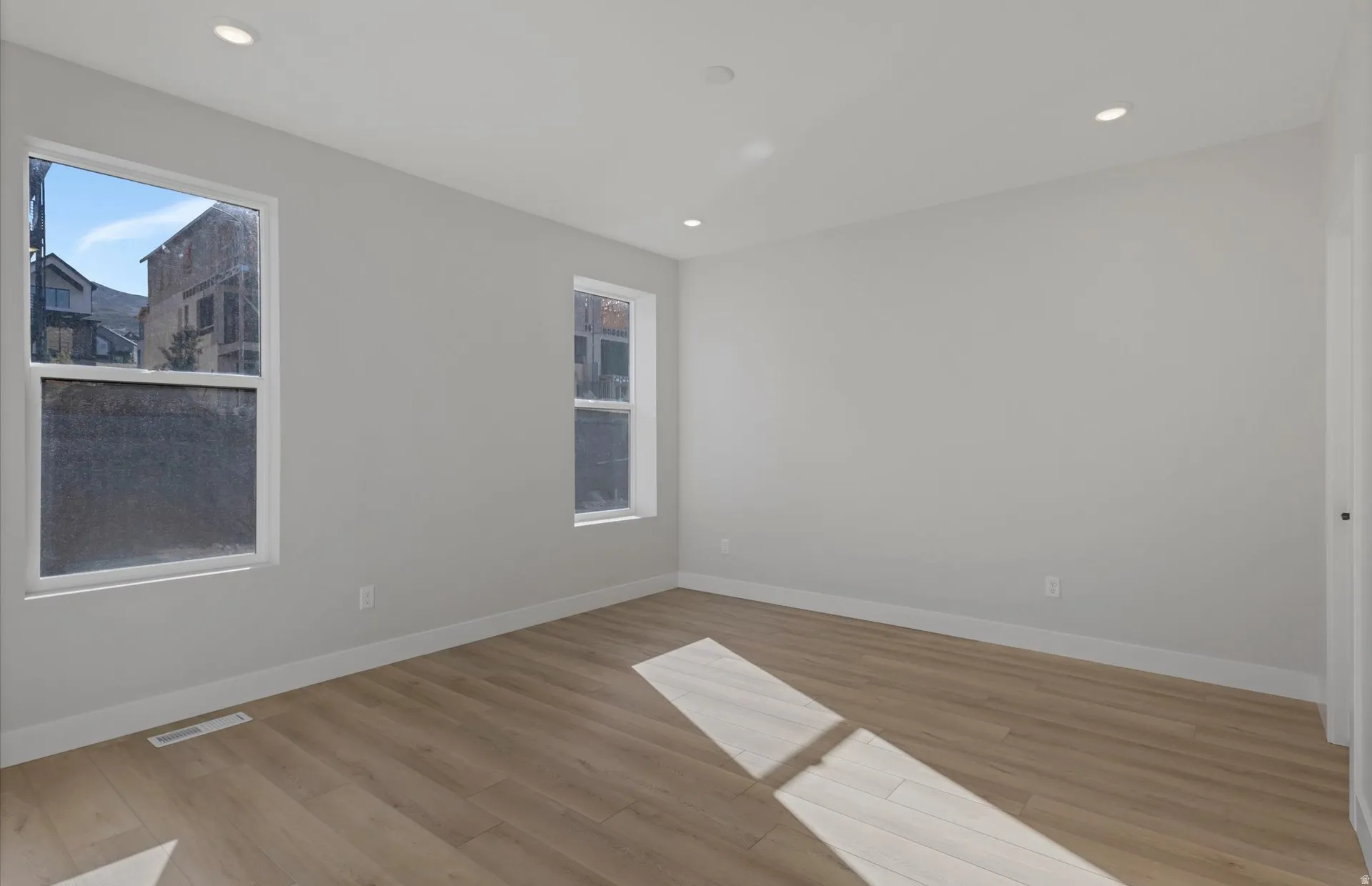 Recessed lighting and wood-finish flooring
