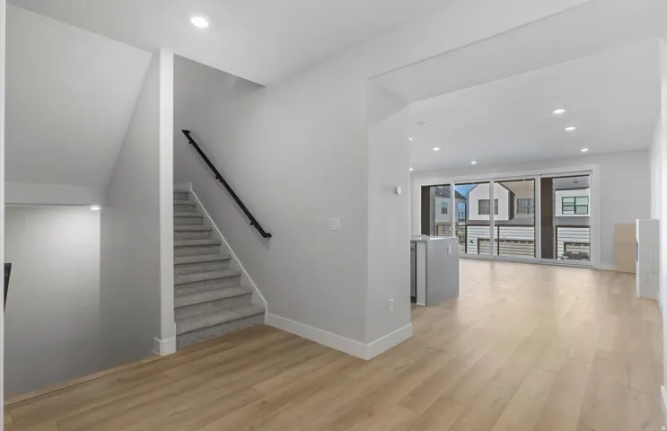 Light wood-finish flooring throughout the main level