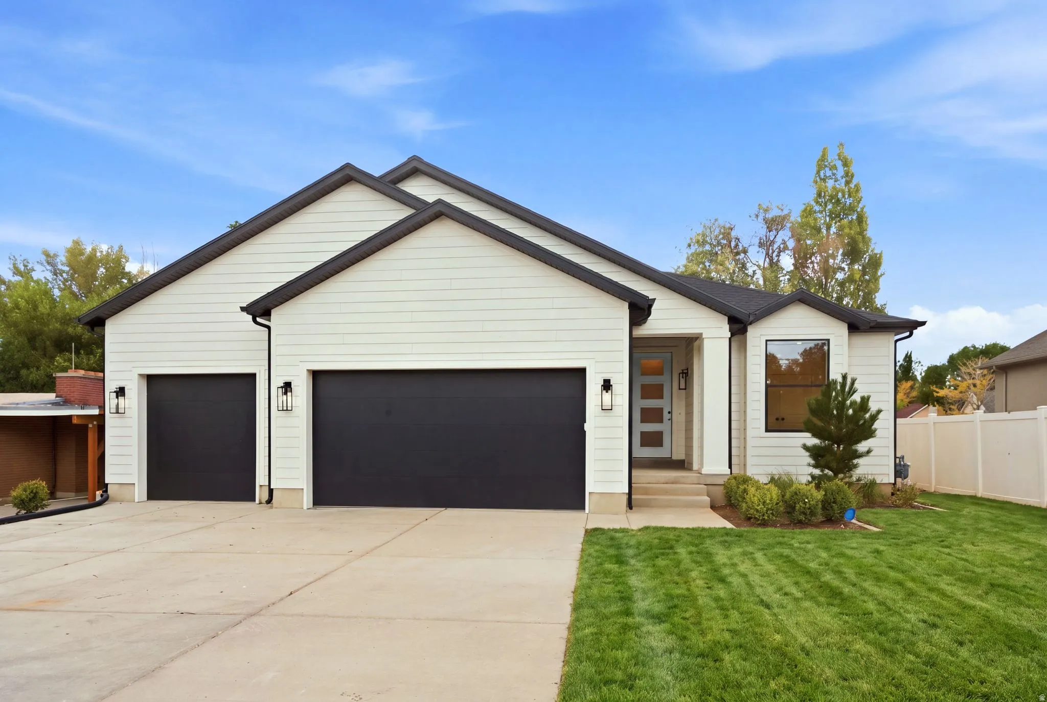 Contemporary exterior with 3 car garage.