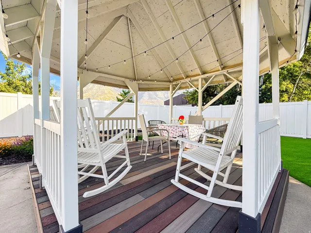 Hexagonal gazebo with multi-tone wood-finish decking