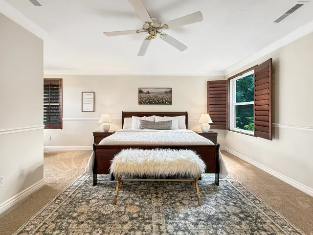 Recessed ceiling fan with light fixture, crown molding, chair rail molding, shuttered windows, and carpet flooring