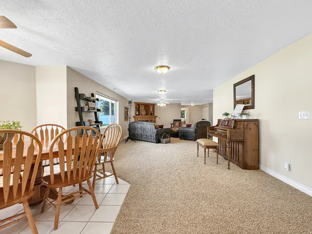 Recessed lighting, ceiling fans, and a built-in corner fireplace