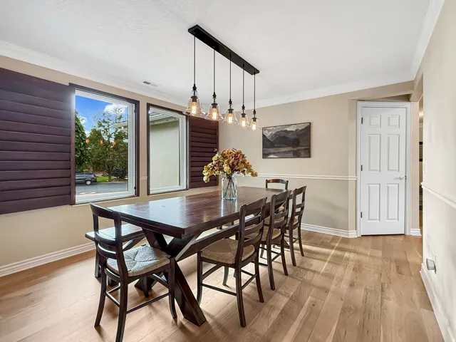 Wood-finish flooring with crown molding and wainscoting