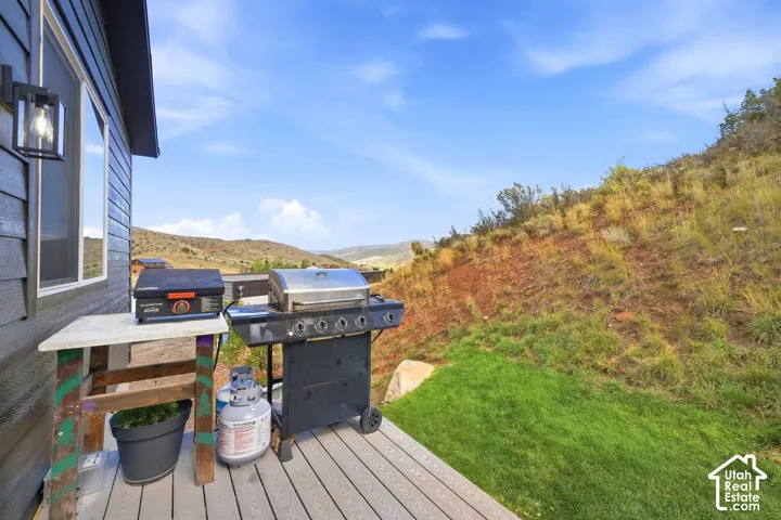 Deck with composite material flooring
