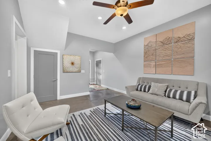 Recessed lighting, ceiling fan, grey wall finish, white baseboard trim, and gray interior doors