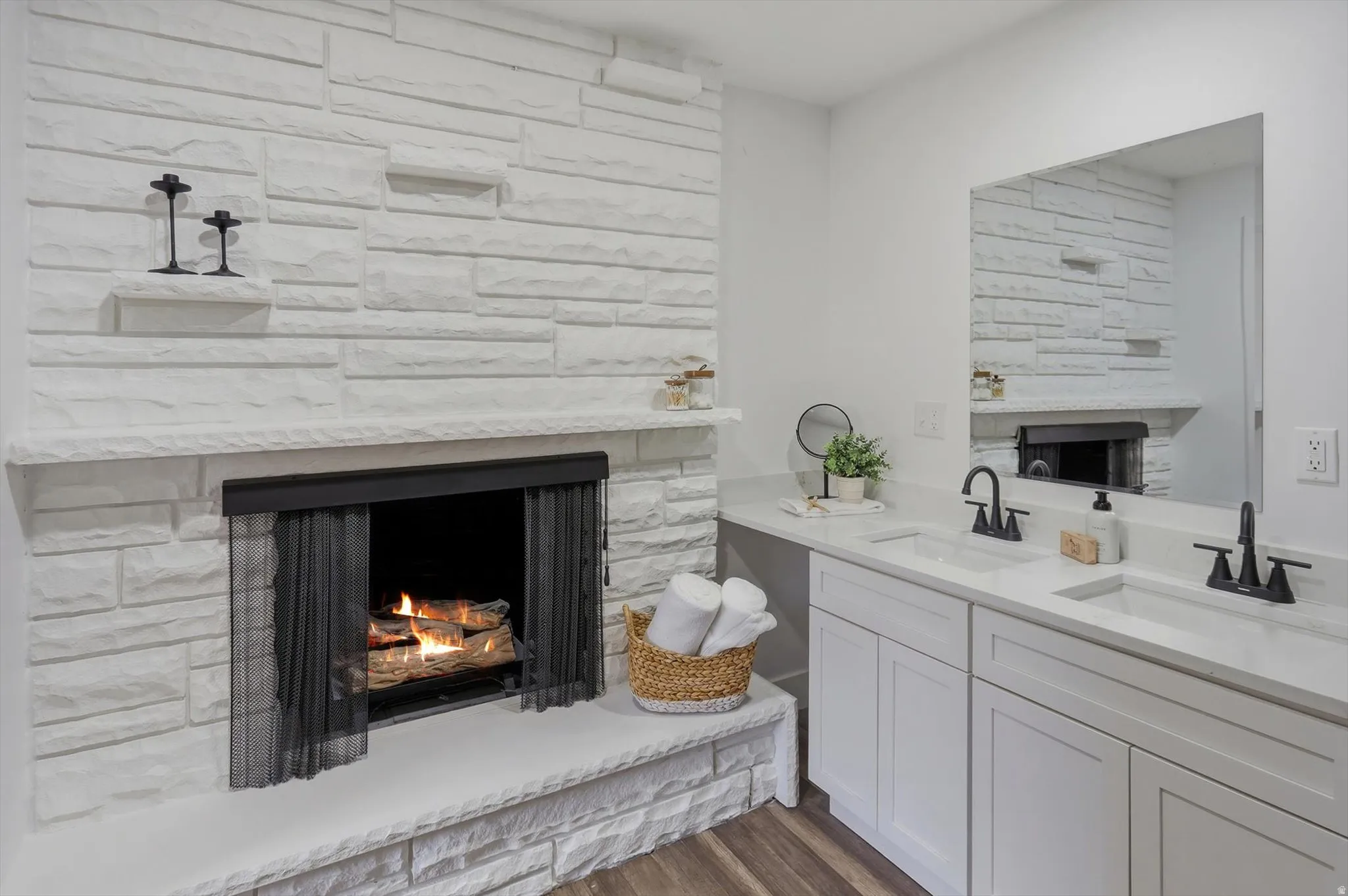 Stacked stone fireplace with a stone mantel