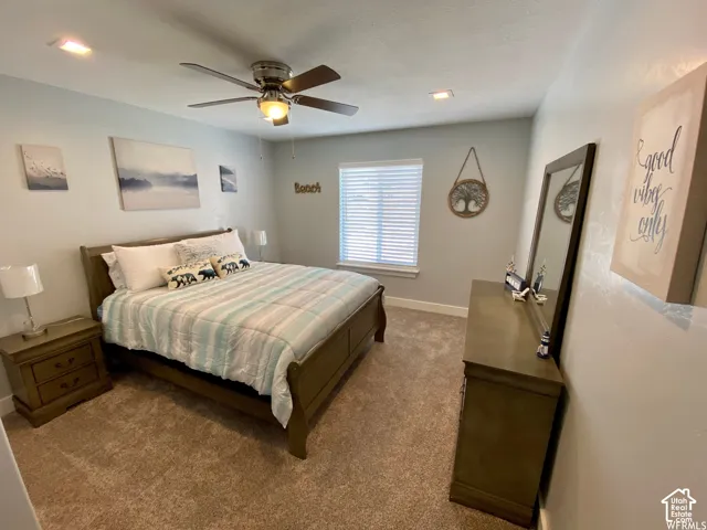 Recessed lighting, ceiling fan, window with blinds, and neutral carpet flooring