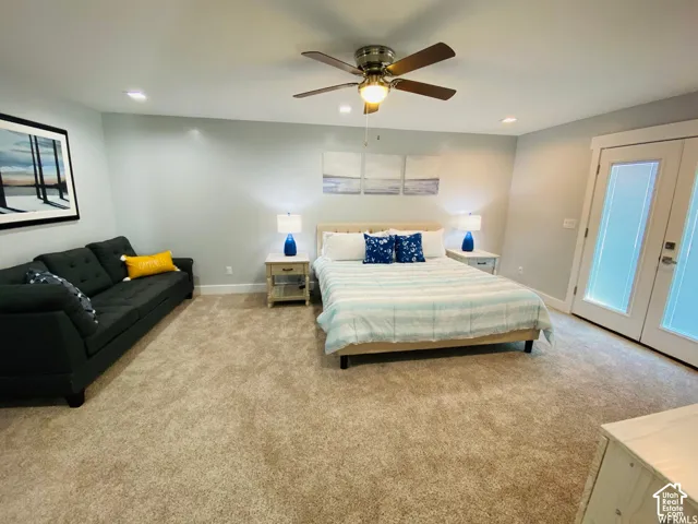 Recessed lighting, ceiling fan, and carpeted flooring
