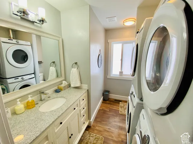 Bathroom with a single vanity, undermount sink, and light-toned countertop