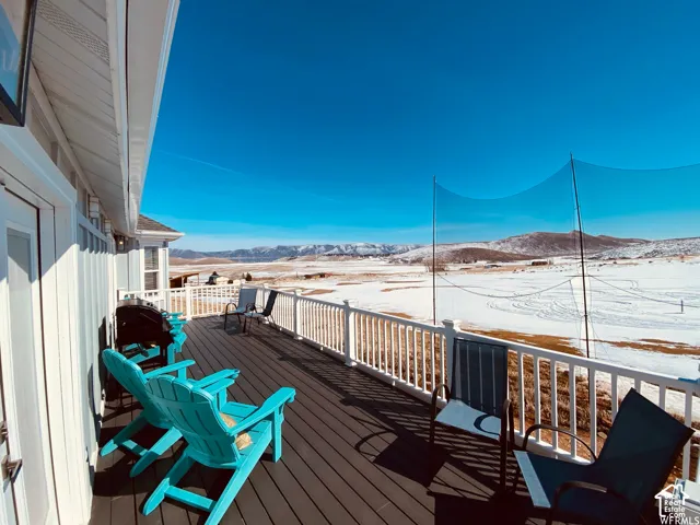 Expansive outdoor deck with a durable composite surface and white railing