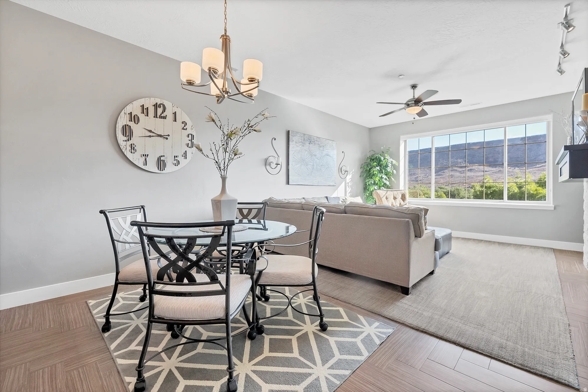 Recessed lighting, wood-finish flooring, and a contemporary ceiling fan