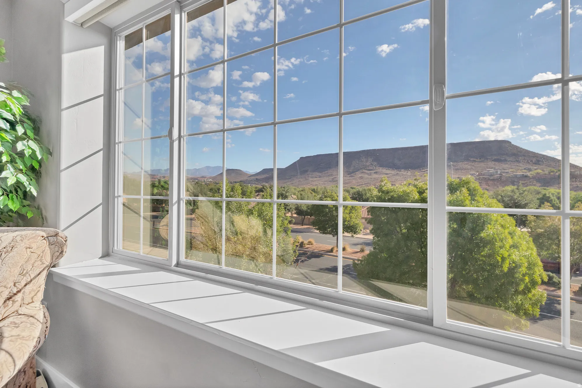 Window with grid pattern and a wide sill