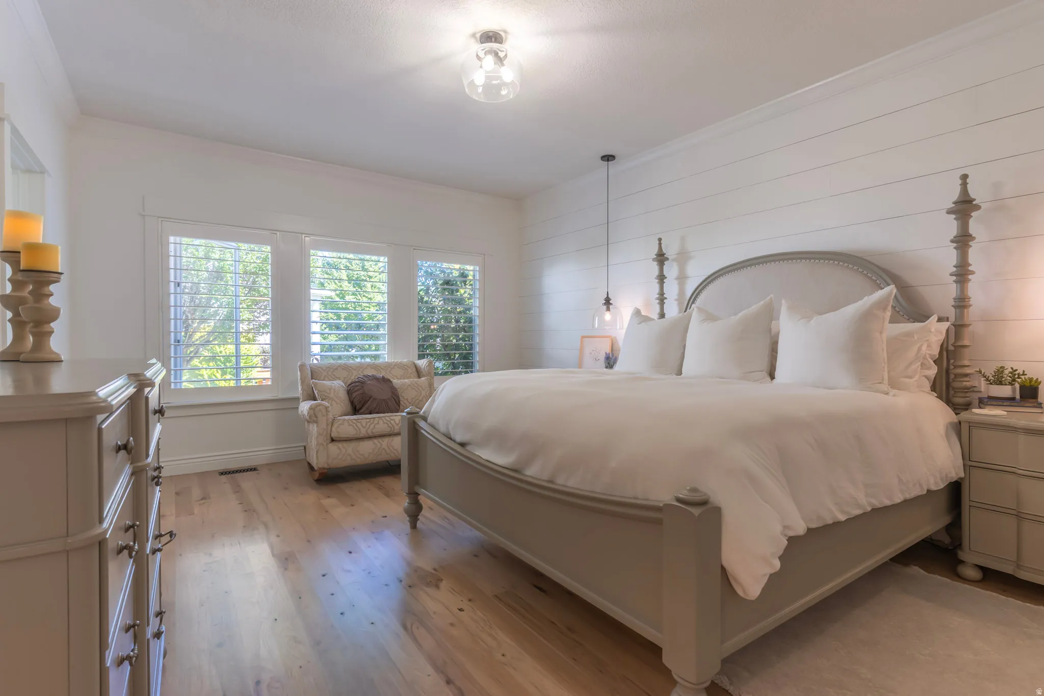 Main level master ensuite w/hickory hardwood & shiplap
