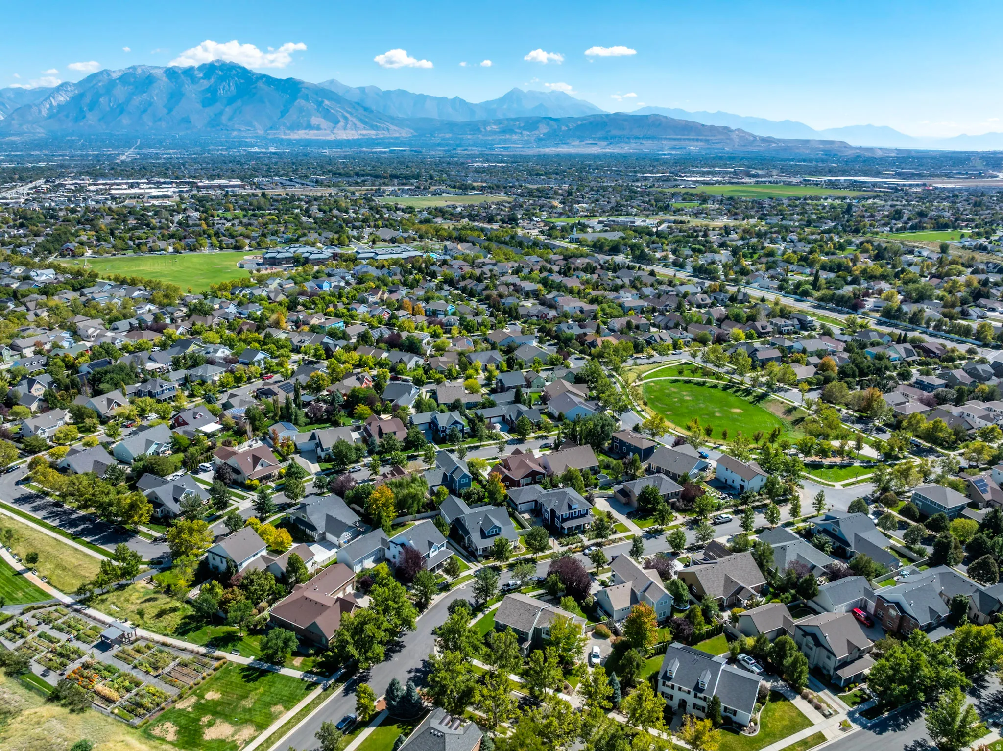 Aerial view of Daybreak community w/mountain view