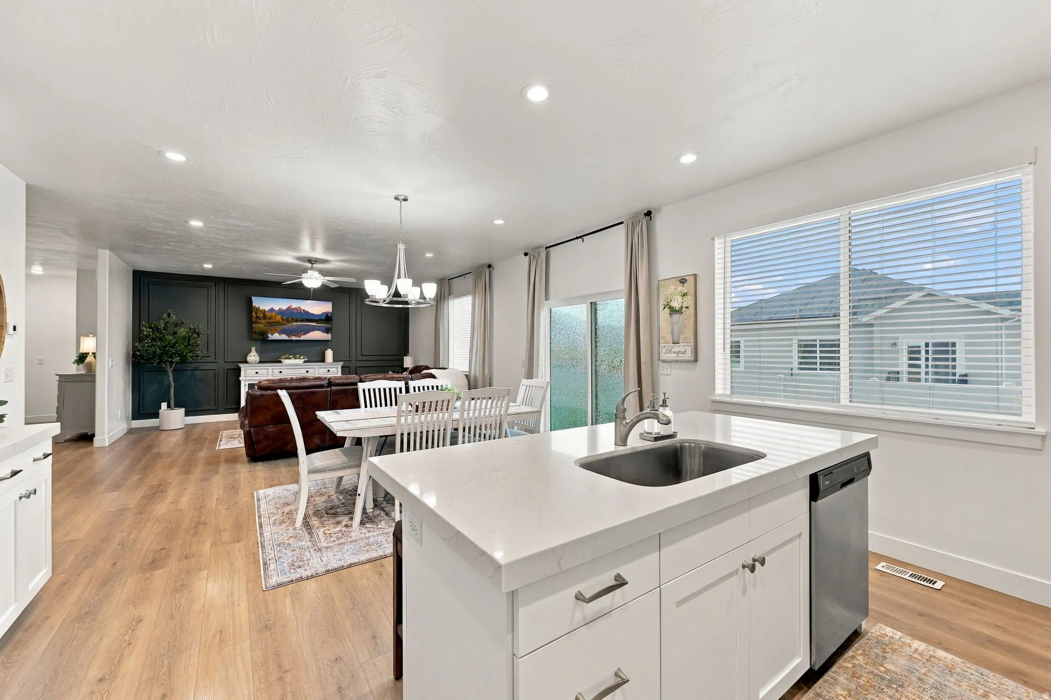 Kitchen island with an undermount sink and stainless steel dishwasher