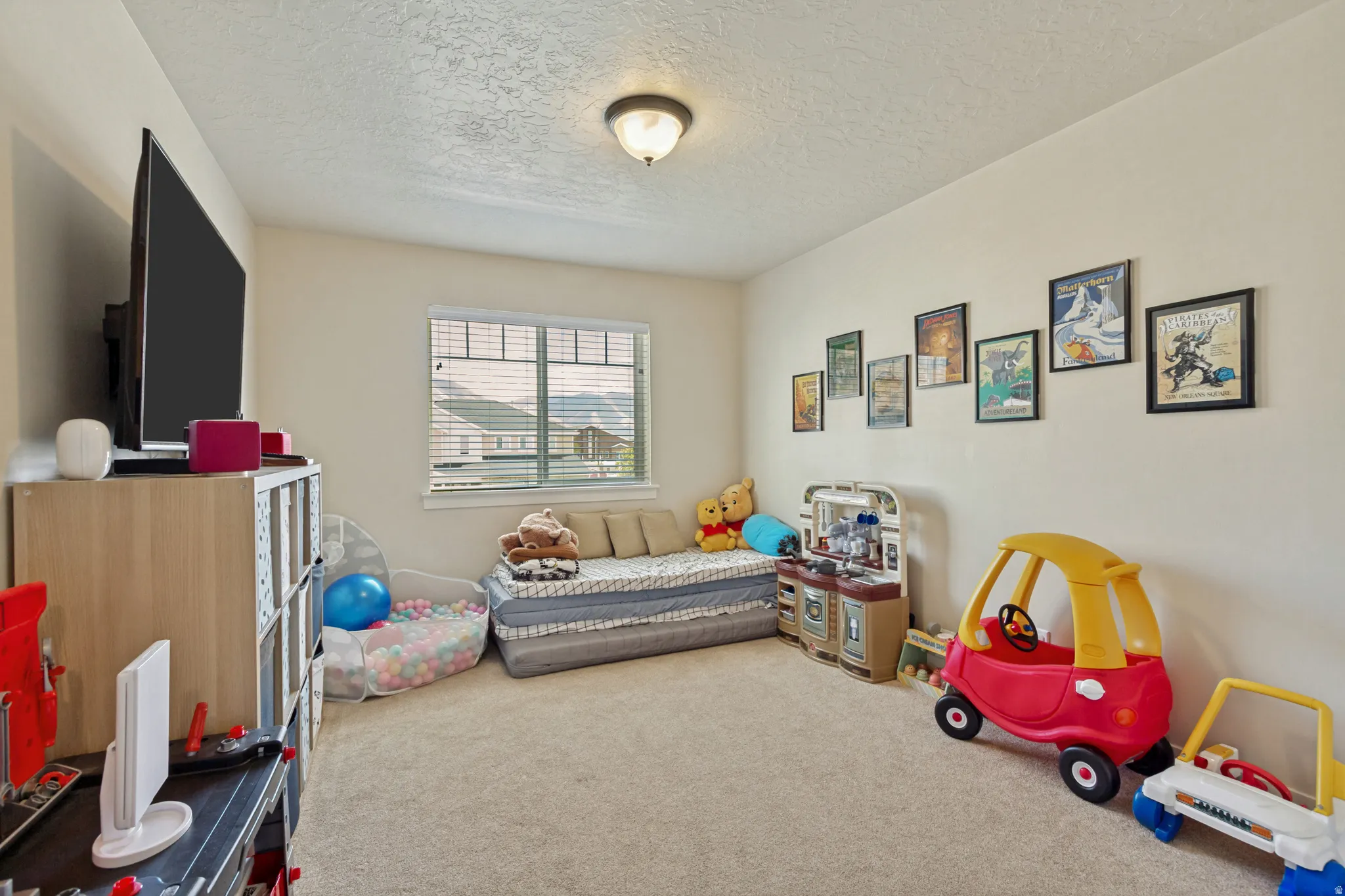 Neutral wall finishes, recessed window, and wall-to-wall carpeting