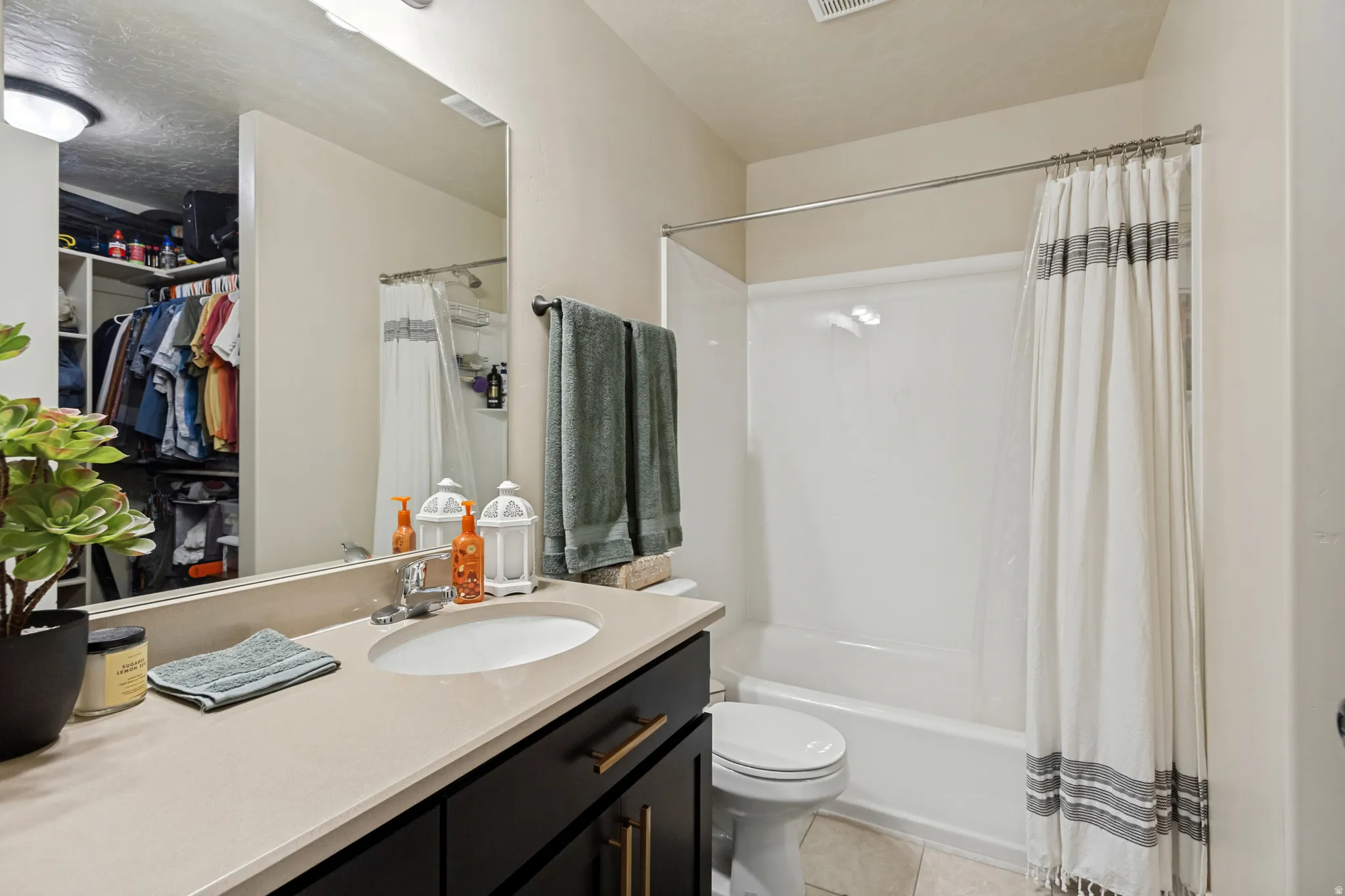 Vanity with an integrated sink and light-colored countertop