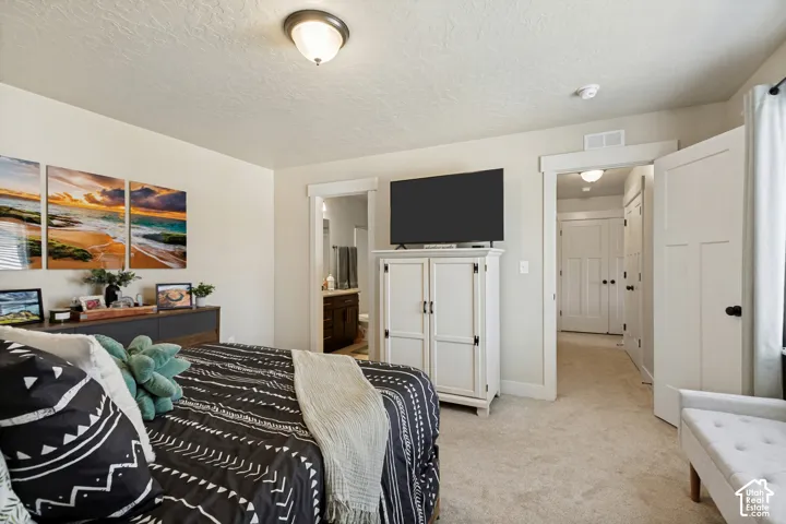Master Bedroom. Window with blinds, wall-to-wall carpeting, and a ceiling light fixture