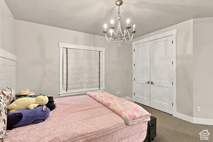 Recessed lighting, chandelier, neutral wall colors, window with white trim, and white double doors
