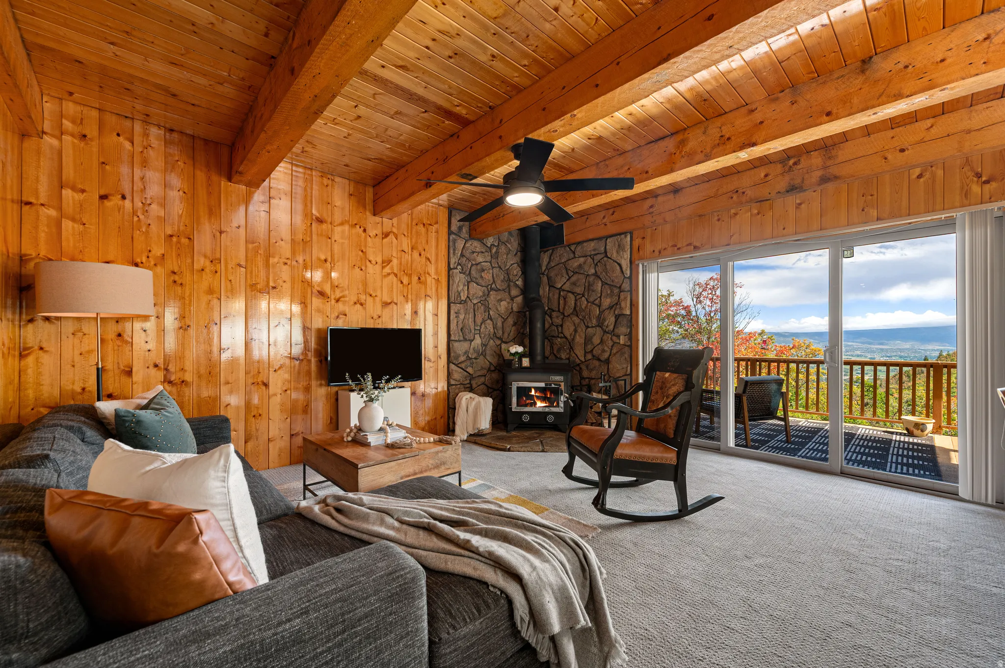 Wood-paneled walls and ceiling with exposed beams