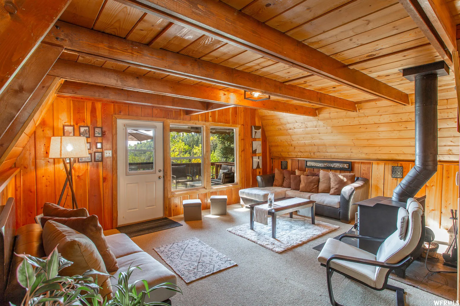 Wood-paneled walls and ceiling with exposed beams