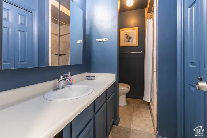 Bathroom vanity with an integrated sink, polished chrome faucet, and storage cabinetry