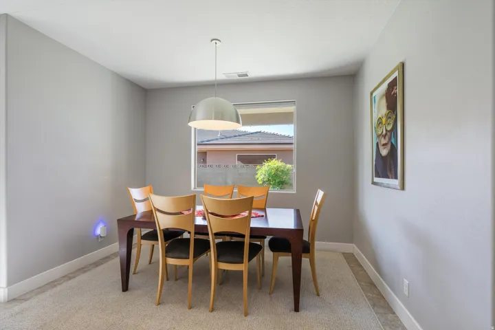 Recessed window, contemporary pendant light, light-colored carpeting