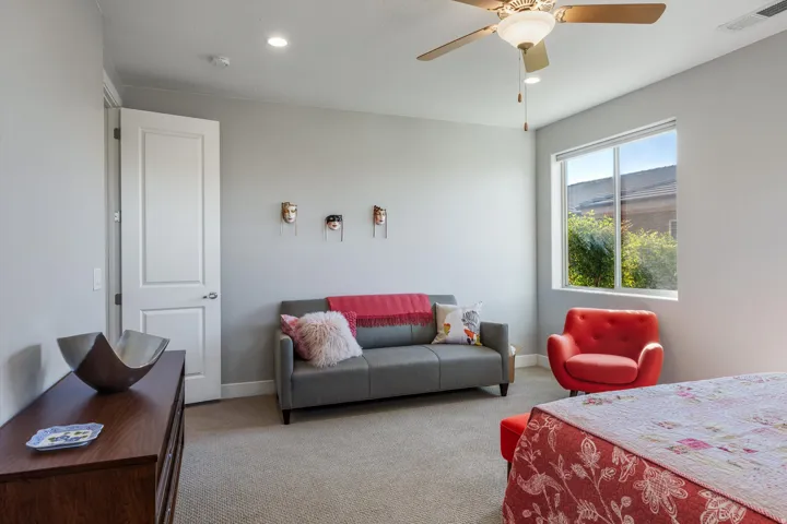 Recessed lighting, ceiling fan with integrated light, window with exterior foliage, white interior door, and neutral-toned wall paint