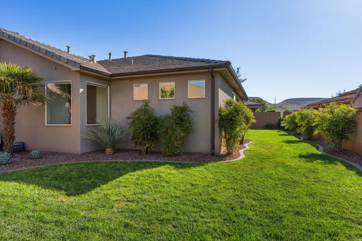 Stucco exterior with a shingle roof