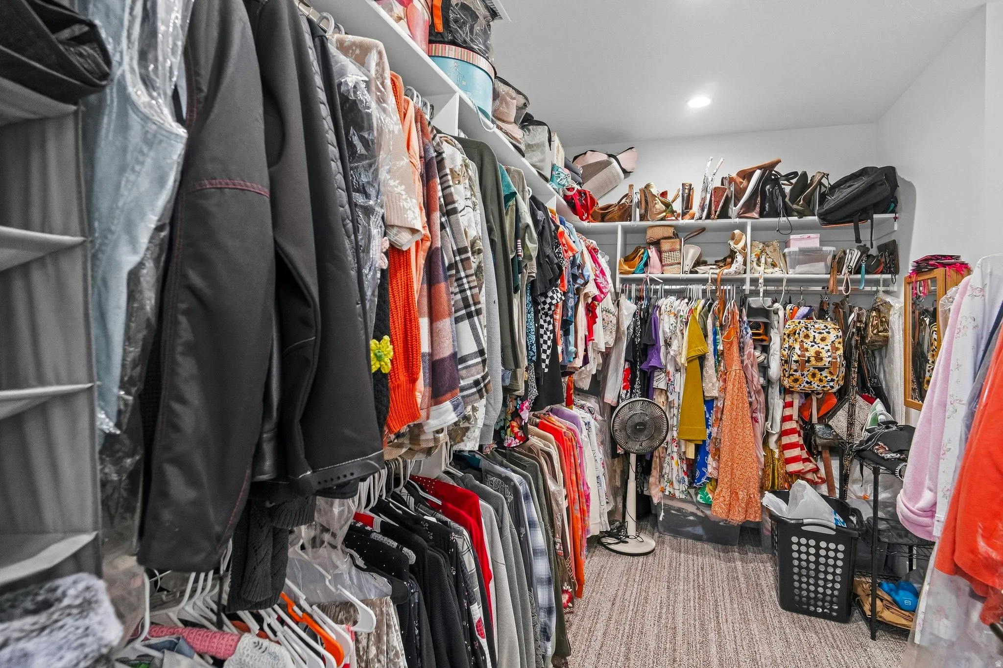 Built-in shelving and hanging rods providing ample storage