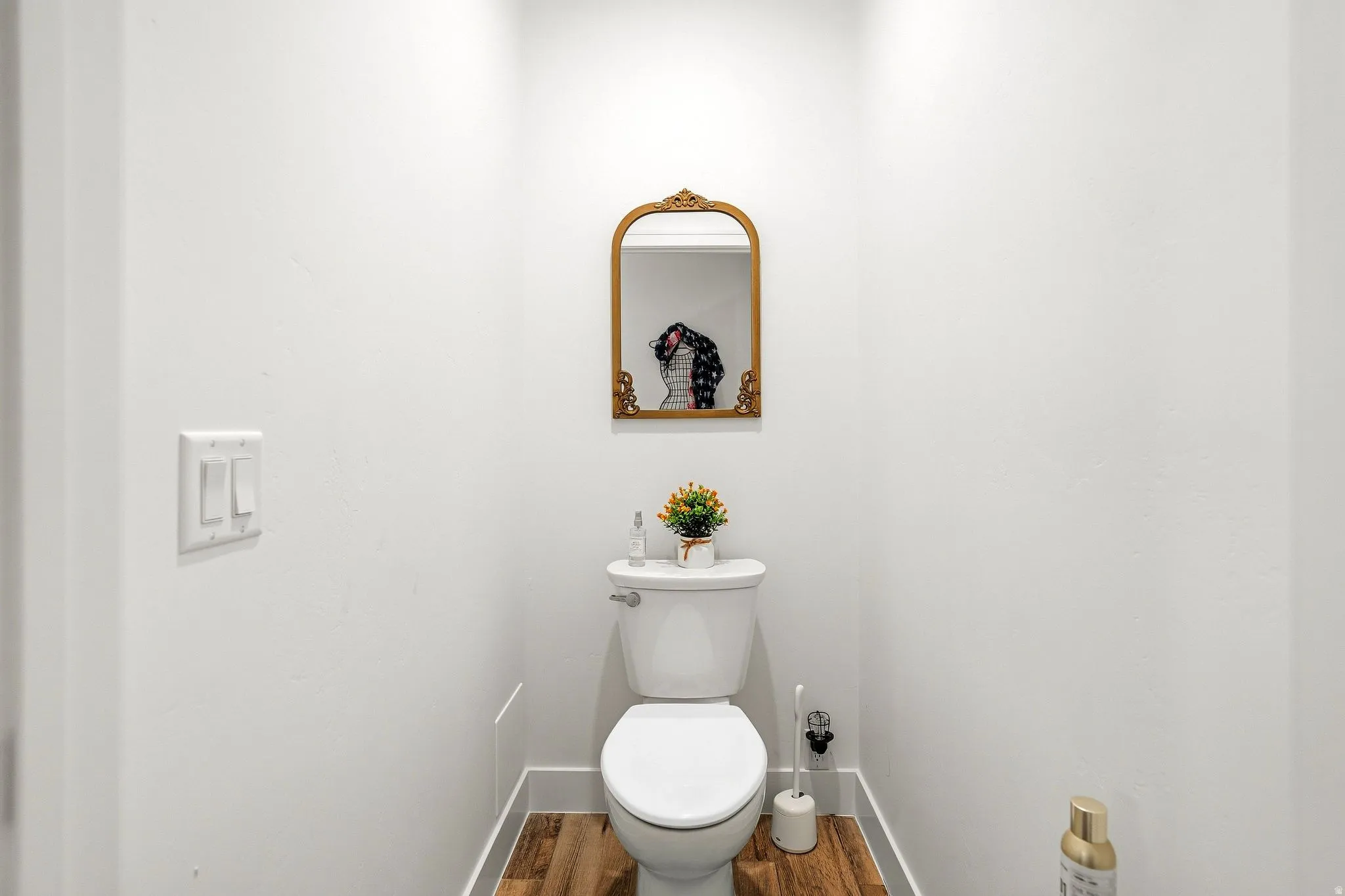 White-painted walls and wood-finish flooring