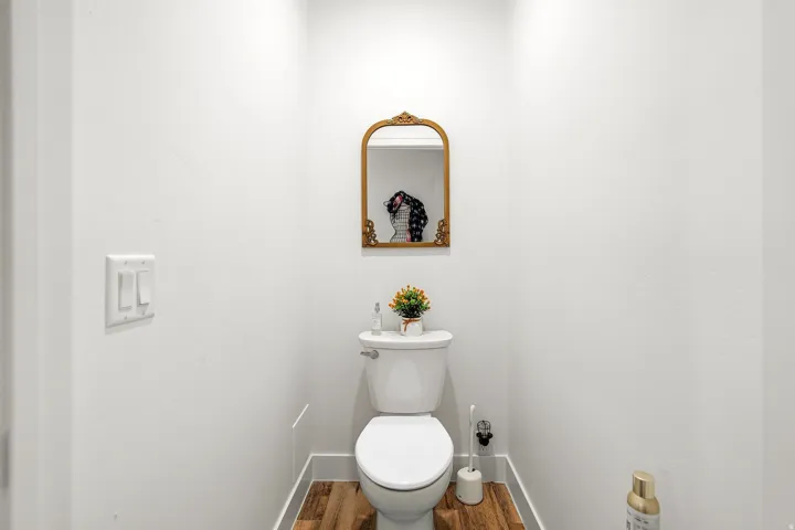 White-painted walls and wood-finish flooring
