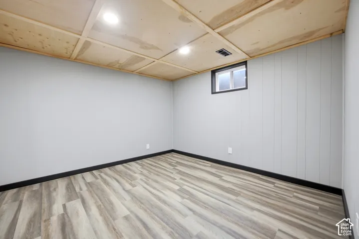 Recessed lighting illuminates the wood-finish ceiling
