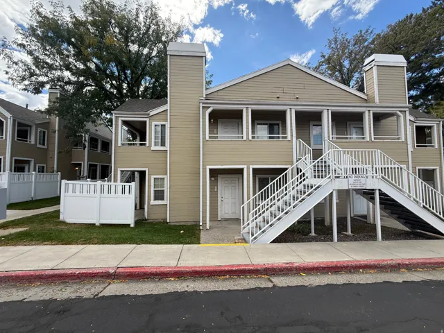 Multi-level exterior with light-colored siding