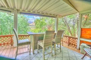 Covered outdoor deck,  lattice railing, and a slatted ceiling