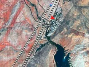 Aerial Map. Depicting the geographic location of Harrisburg, a body of water, and Interstate 15 highway