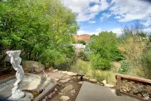 Tiered landscaping featuring stone elements and lush greenery