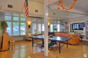 Ping pong game played daily on the spacious dance floor.