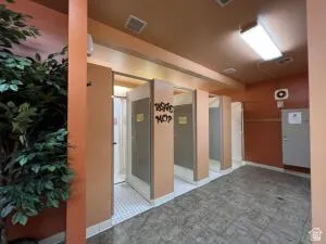 Woman's dressing room with showers, stalls and vanities