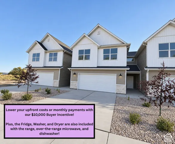 Modern two-story home featuring a clean contemporary exterior with peaked gable rooflines, composite siding in neutral tones, and large multi-pane windows