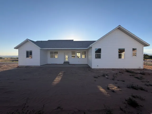 White horizontal siding exterior with a light-colored shingle roof