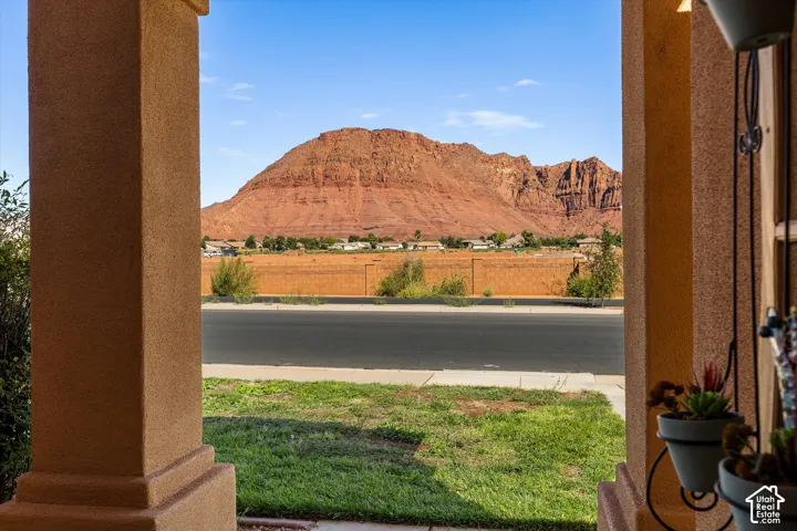 Stucco exterior columns framing a mountain backdrop
